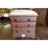 A table top three drawer chest,