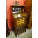 A Victorian walnut music cabinet