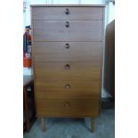 A teak chest of drawers