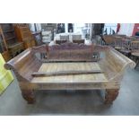 A Balinese carved hardwood settee