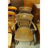 A pair of oak office armchairs