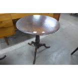 A George III style oak circular tripod table