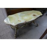 A brass and onyx coffee table