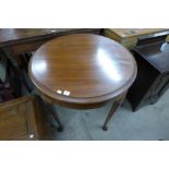 A mahogany circular centre table