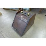 A Victorian mahogany coal scuttle