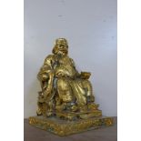 A gilt metal figure of a seated Chinese Emperor