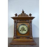 A 19th Century German Junghans walnut mantel clock and four others