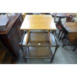 An oak trolley and a teak occasional table