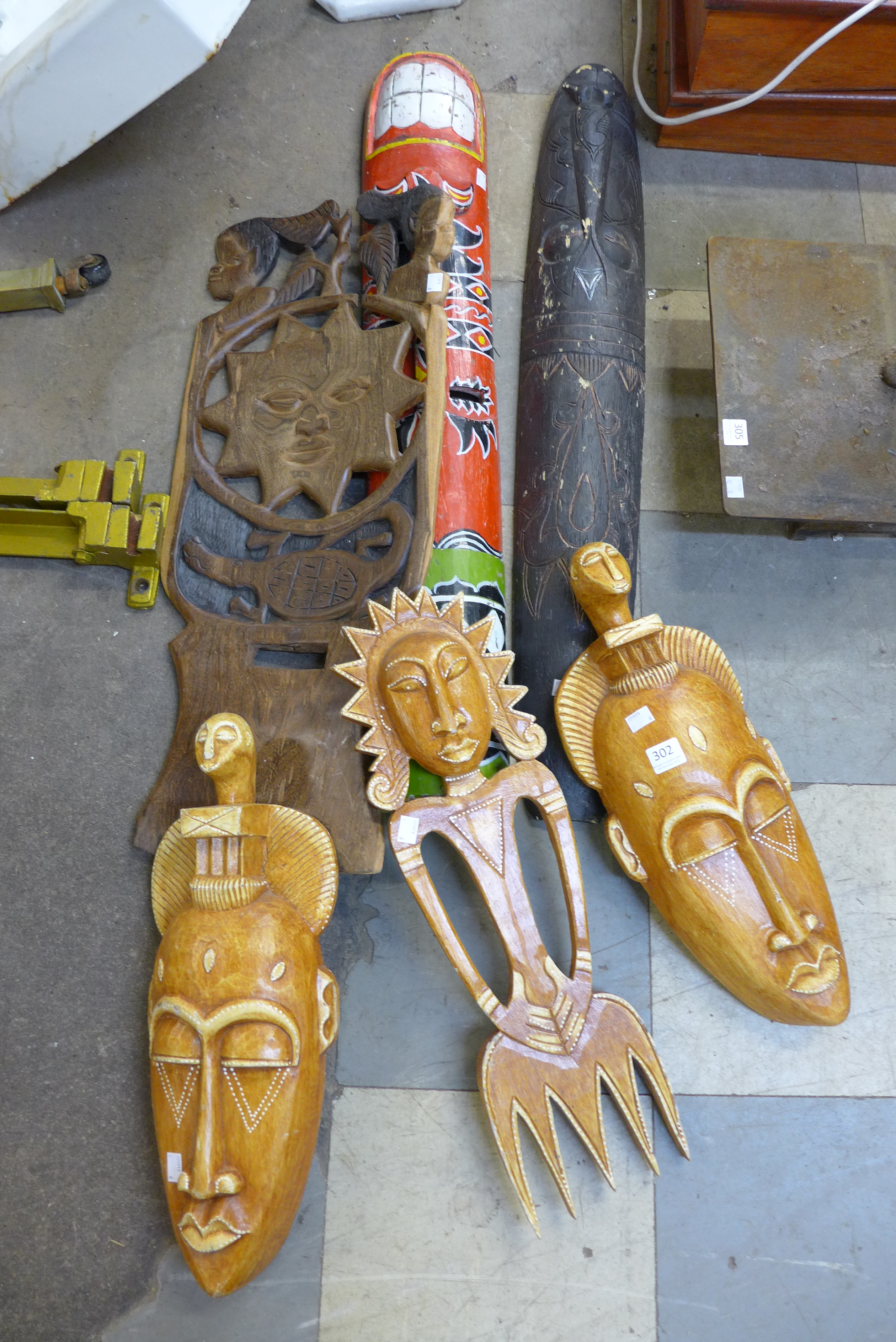 Six African carved wooden masks/plaques