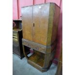 An Art Deco burr walnut cocktail cabinet