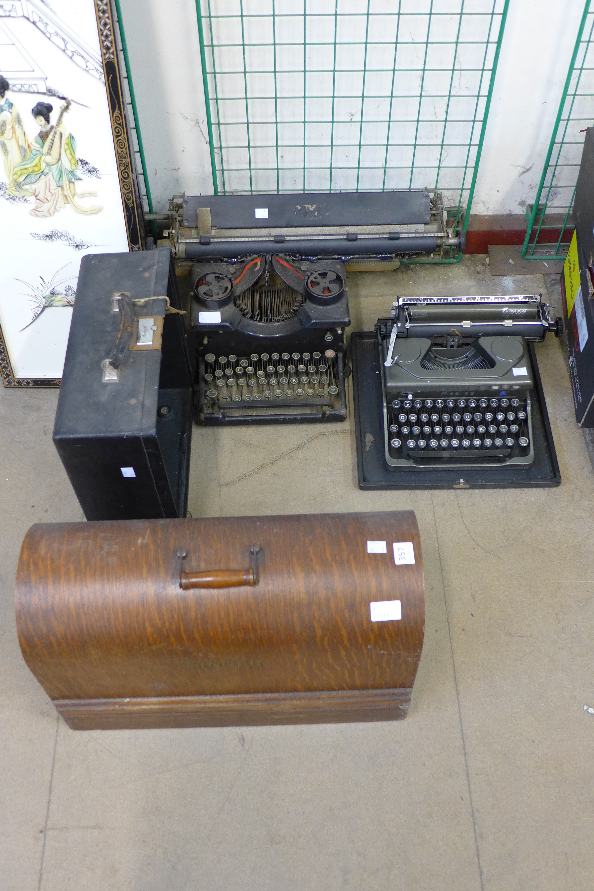 Two typewriters and a Singer sewing machine