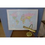 A Political wall map of the world and a student's desk lamp