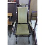 An early 20th Century American beech rocking chair