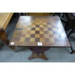 A Victorian rosewood sewing and gaming table