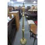 A gilt standard lamp