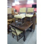 An oak draw leaf table and four chairs