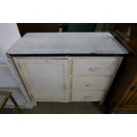 An enamelled and painted kitchen cupboard