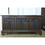 A carved oak blanket chest
