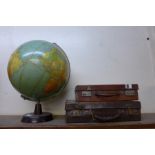 Two small cases and a terrestrial globe on stand