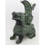 An oriental metal figure or centrepiece of a dog, height 22.