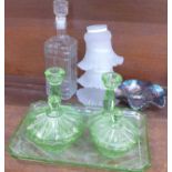 A green glass dressing table set, a blue carnival glass dish,