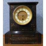 A 19th Century French Belge noir mantel clock and warming pan