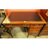 An Edward VII inlaid mahogany kneehole desk