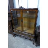 A walnut display cabinet