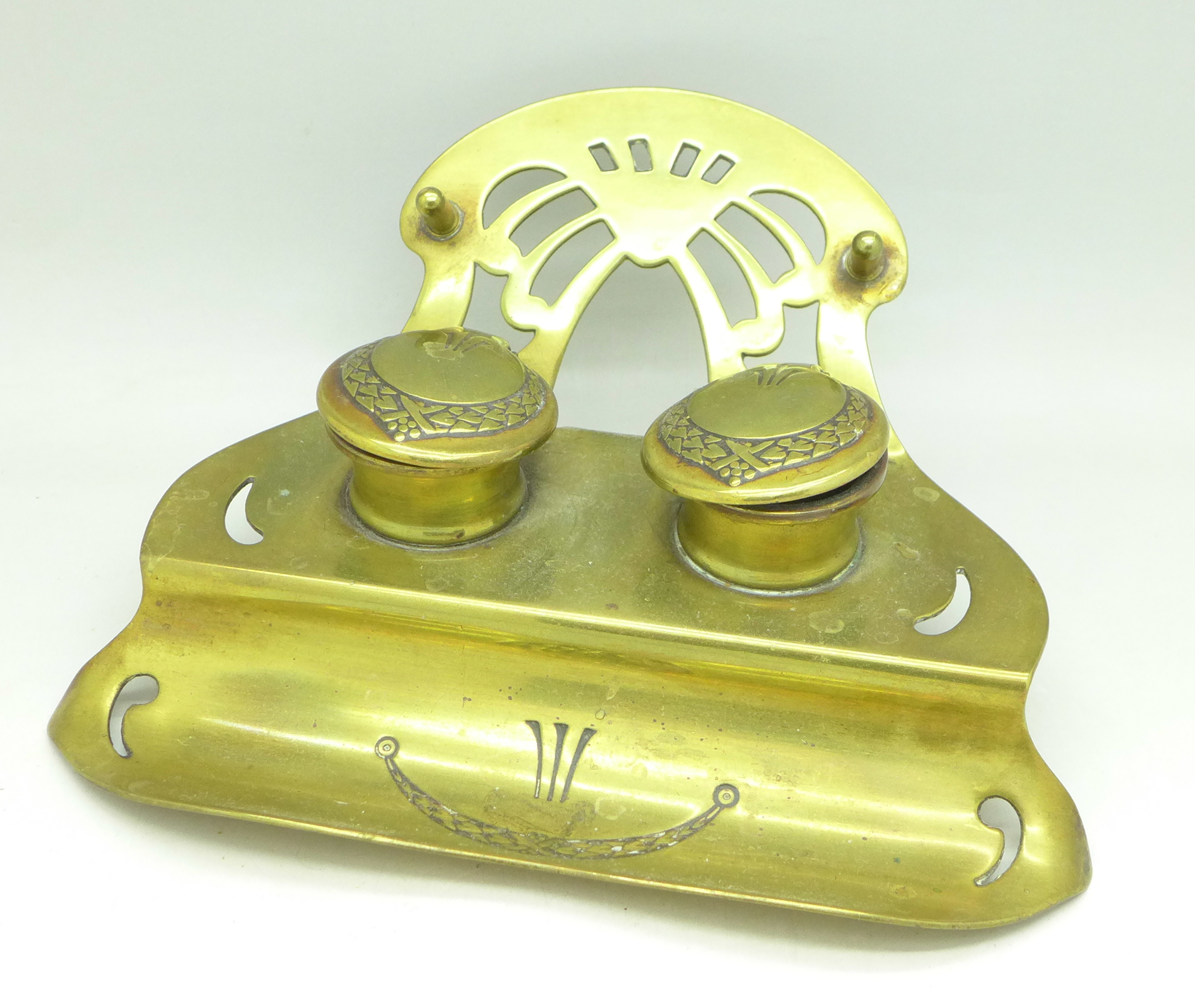 A brass Art Nouveau ink stand, marked Ges.