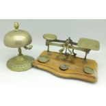 A set of postal scales marked Parkins & Gotto and a brass desk bell