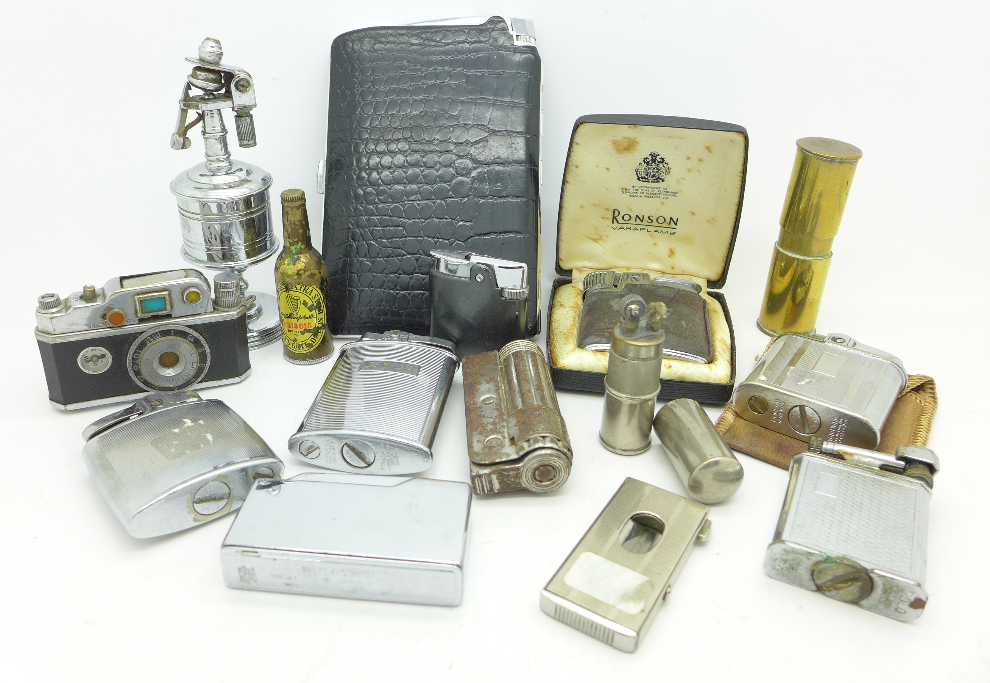 A collection of fifteen lighters including Anglia table lighter, a Japanese novelty camera lighter,