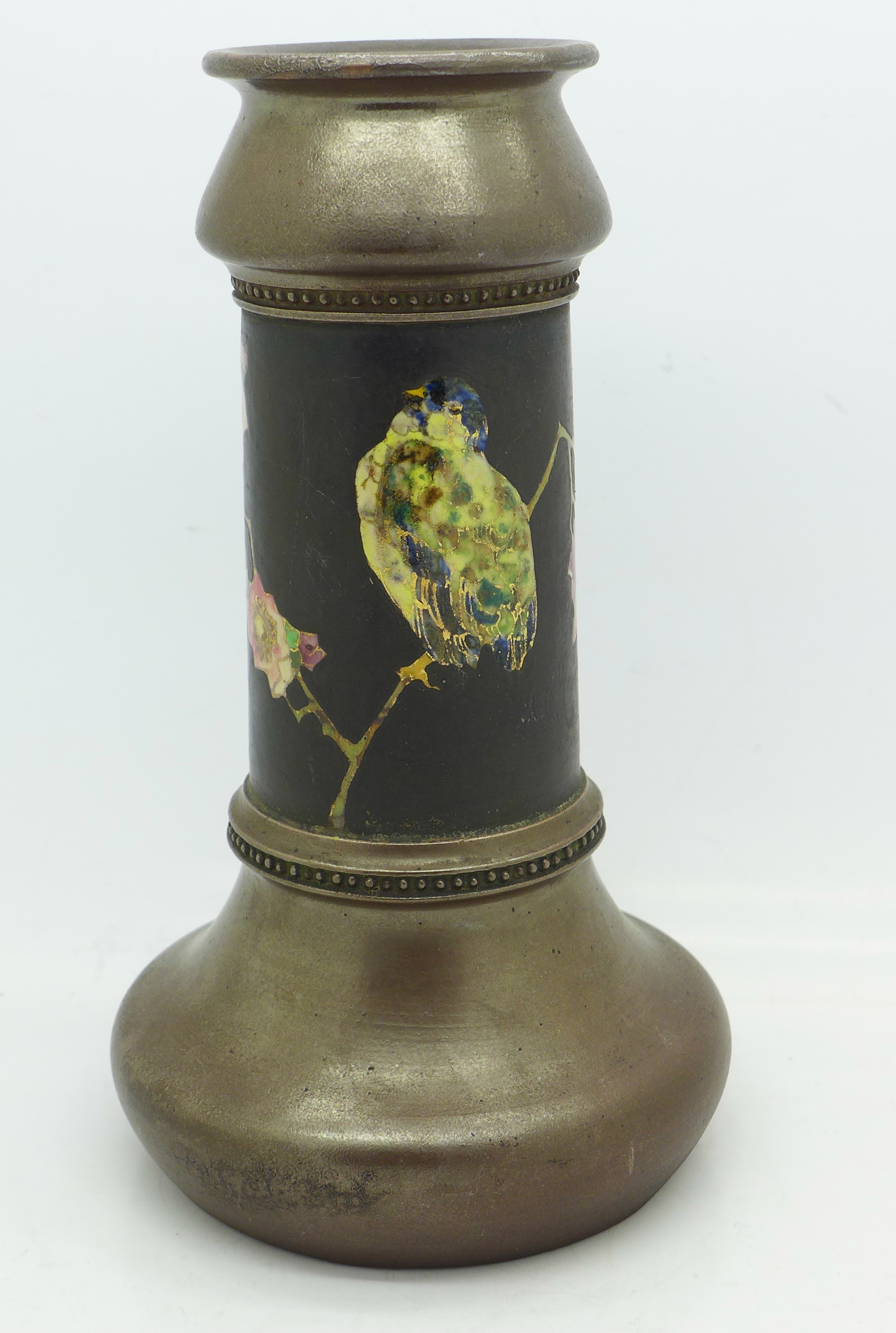 A Bretby vase decorated with a bird and flowers, 18.