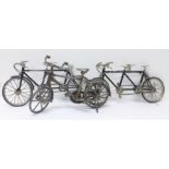 Two model tandem bicycles and one other model bicycle,