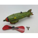 A tin-plate model Zeppelin airship, marked Aeronave Miniatura, 23.