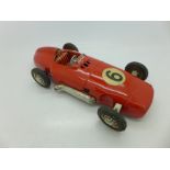 A 1950's tin-plate model racing car, marked Made in Western Germany, clockwork, 24.