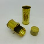 Two items of trench art and a pill box,