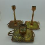 A pair of Art Nouveau candlesticks with matching matchbox holder,