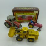 A Dinky Toys, Massey-Harris Farm Tractor, a Cursor-Modell 569 digger,