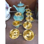 A six setting green and gilt coffee service marked Stavangerflint,