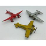 Three 1940s model aircraft, one die-cast and marked made in England and two tin-plate,