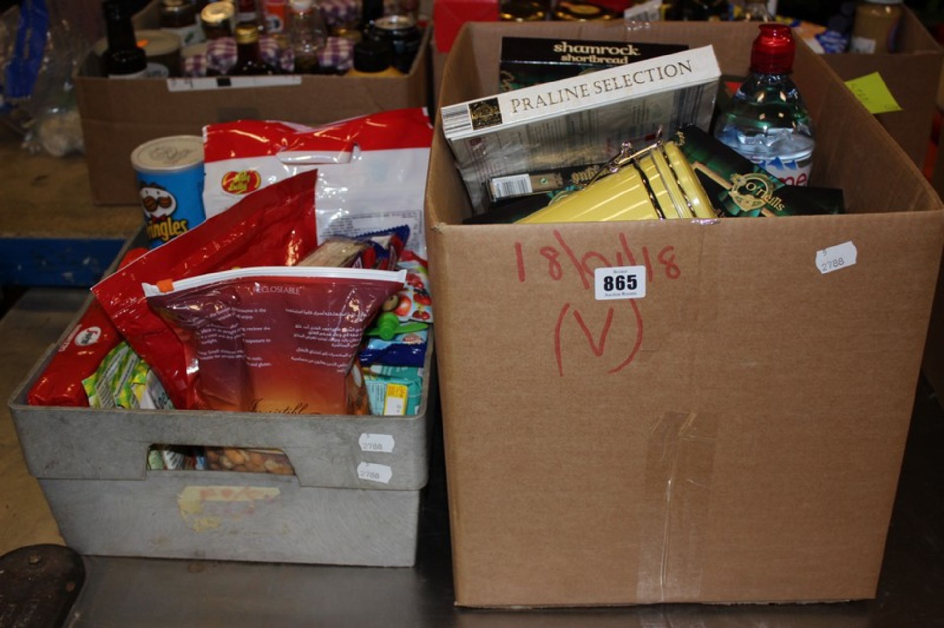 Two boxes of assorted food items and confectionery.