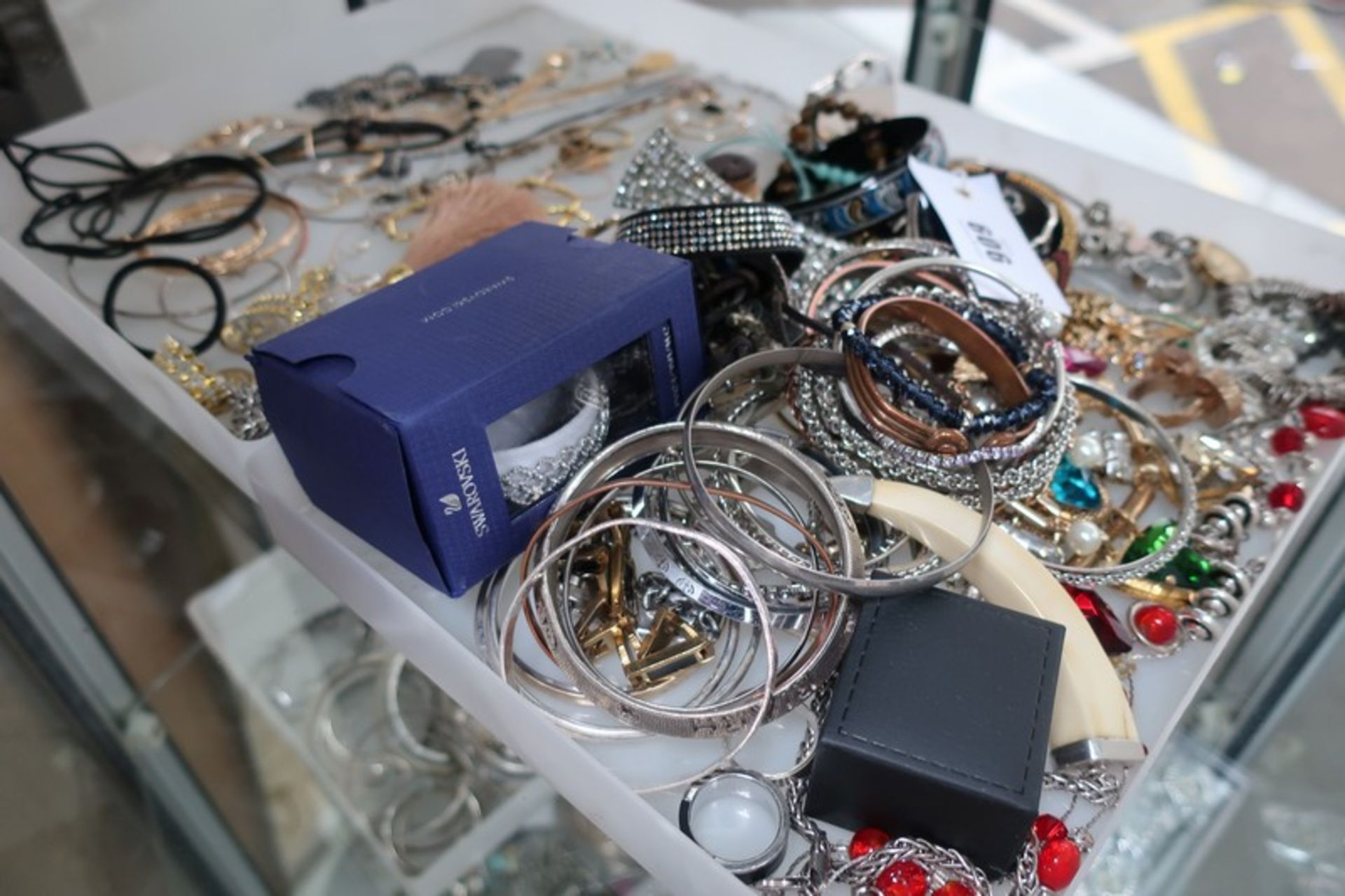 A collection of white and yellow costume jewellery.