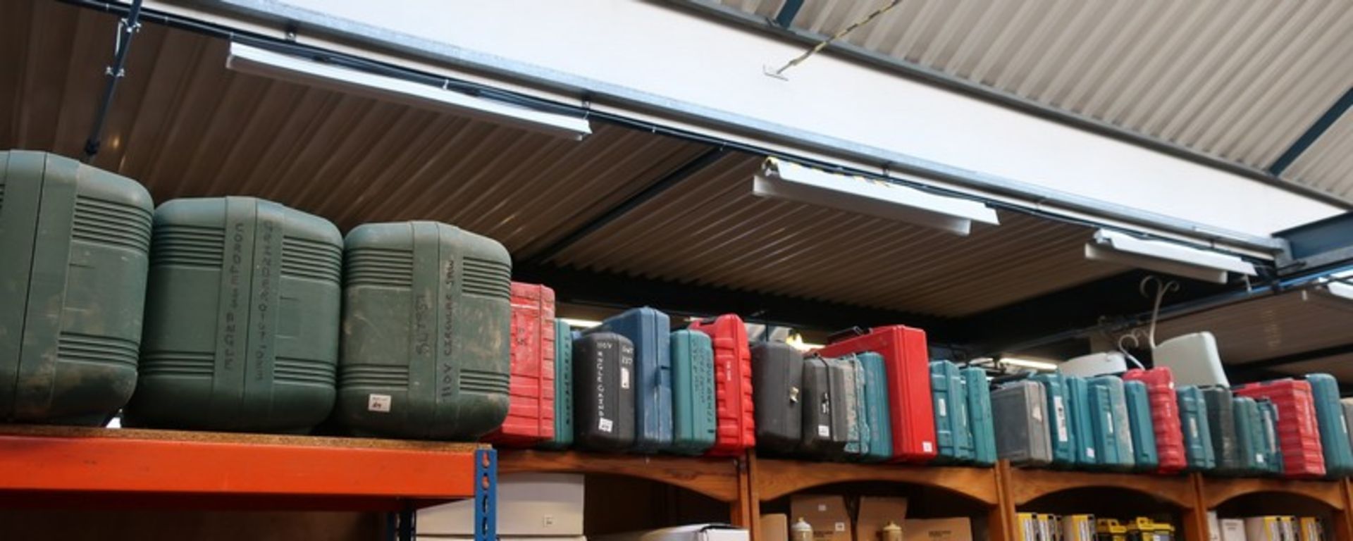 A quantity of empty Hilti and Makita tool boxes.