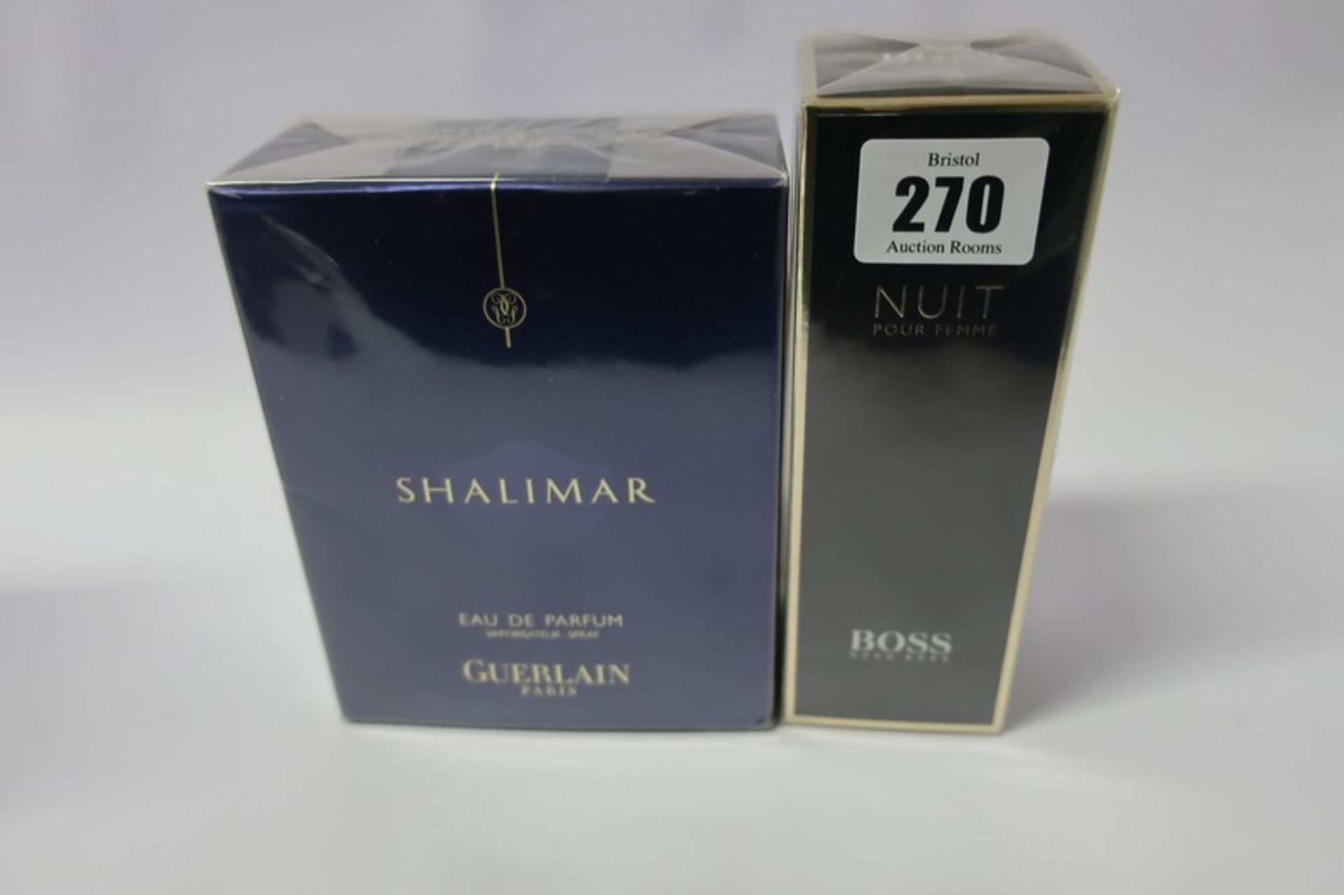 Two Guerlain Shalimar eau de parfum (90ml) and a Hugo Boss Nuit pour femme eau de parfum (50ml).