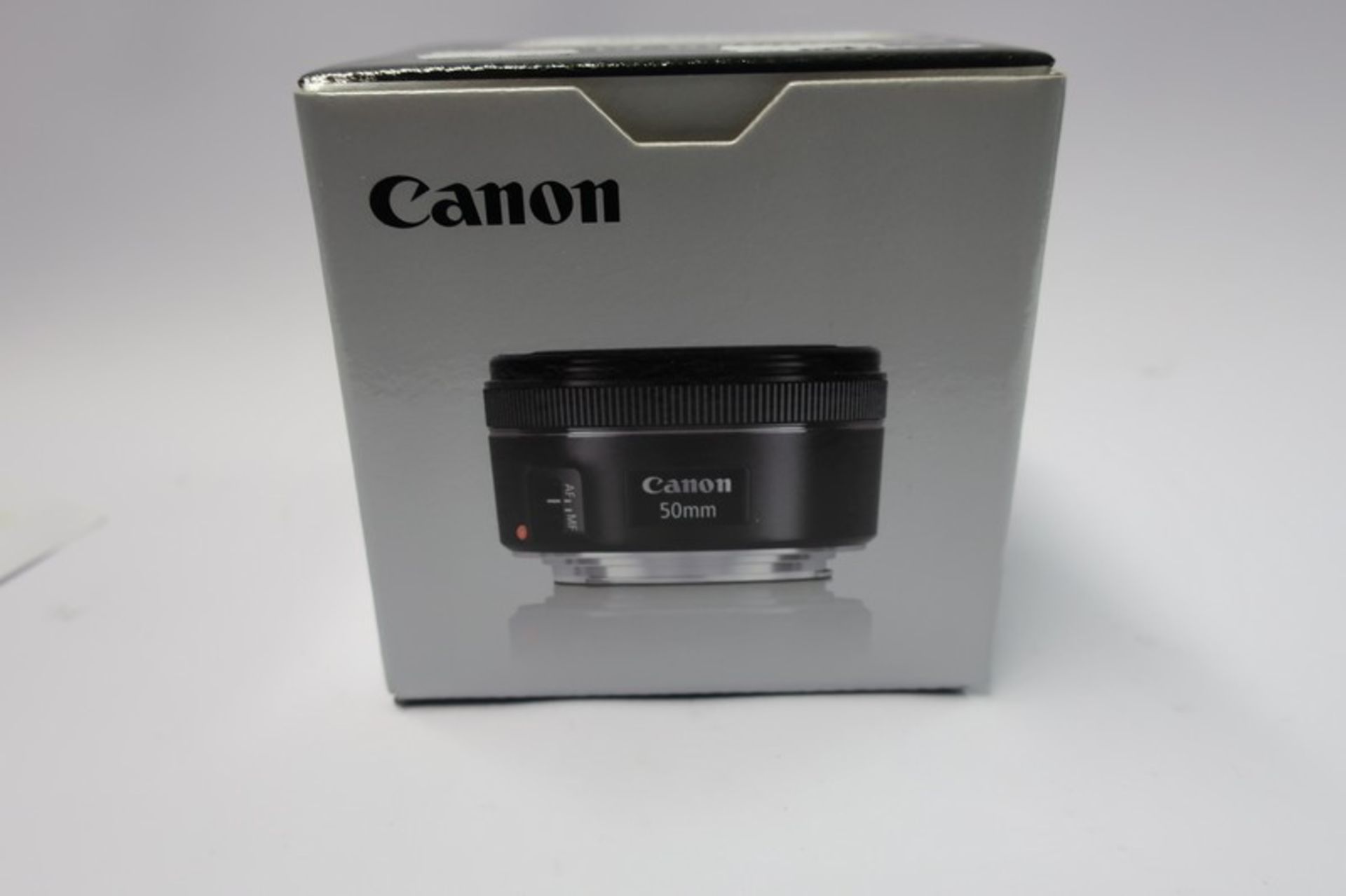 A boxed as new Canon EF 50mm f/1.8 STM lens.