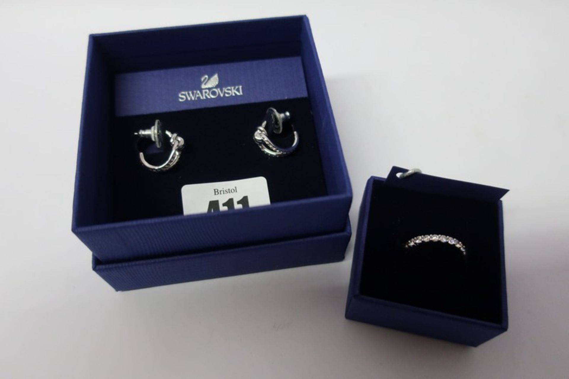 A pair of Swarovski (5390814) lifelong hoop pierced earrings, a Swarovski (5257465) Vittore white