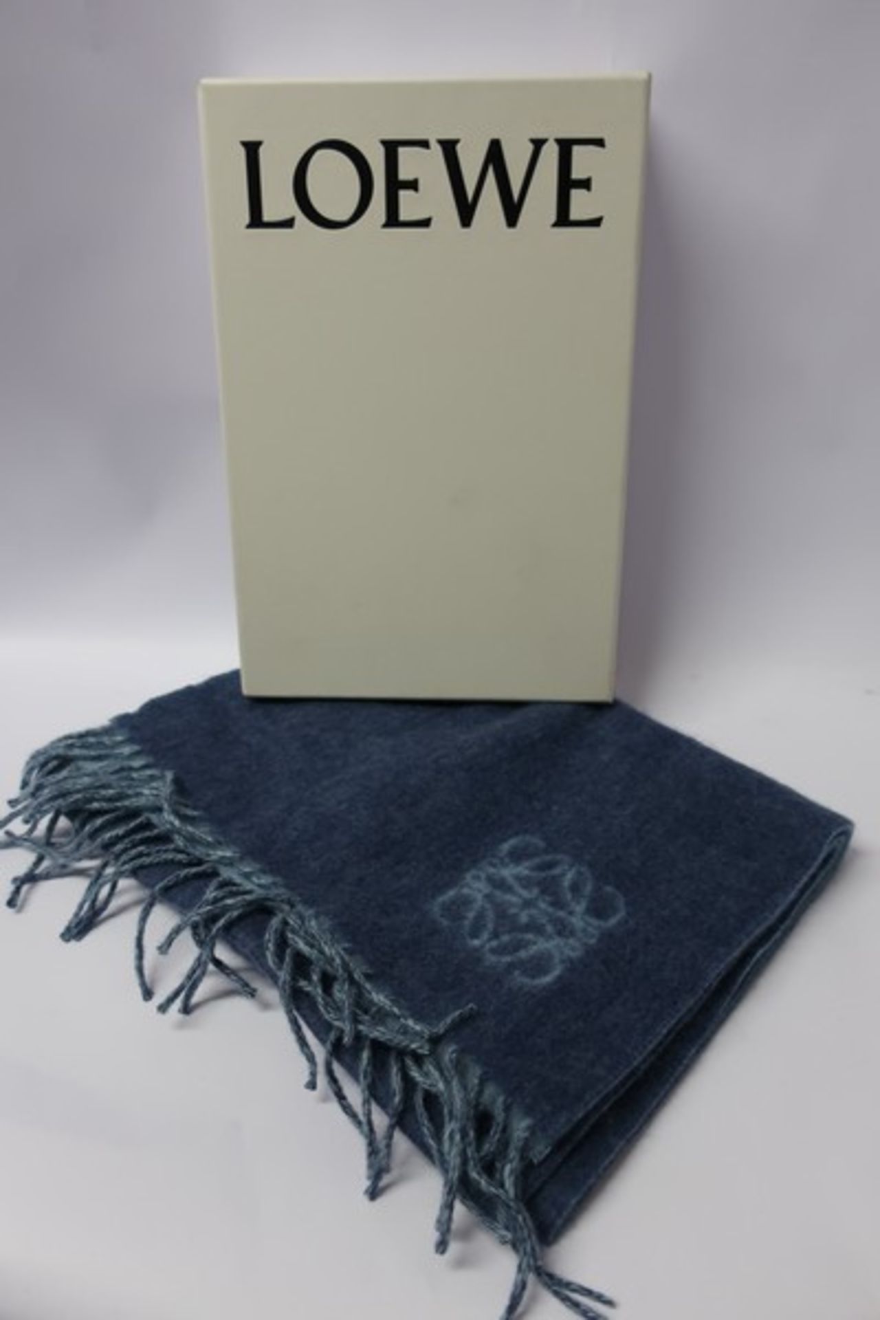 A boxed as new wool/angora Loewe scarf in pale blue.