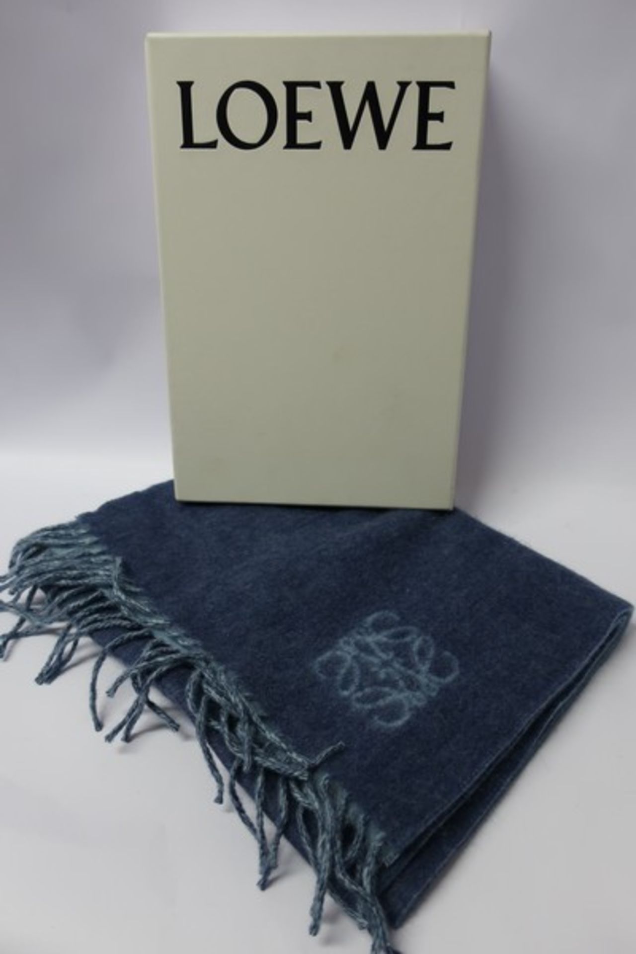 A boxed as new wool/angora Loewe scarf in pale blue.