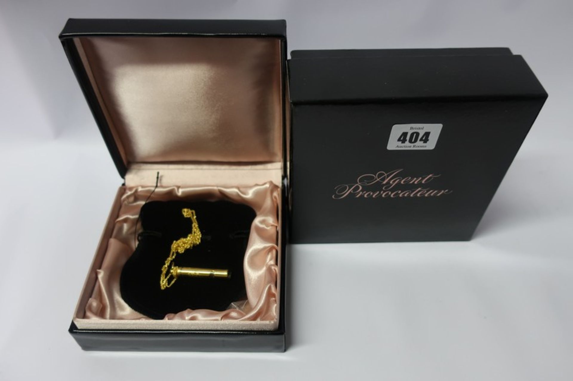 Two boxed as new Agent Provocateur mini gold coloured whistle necklaces (Size OS)