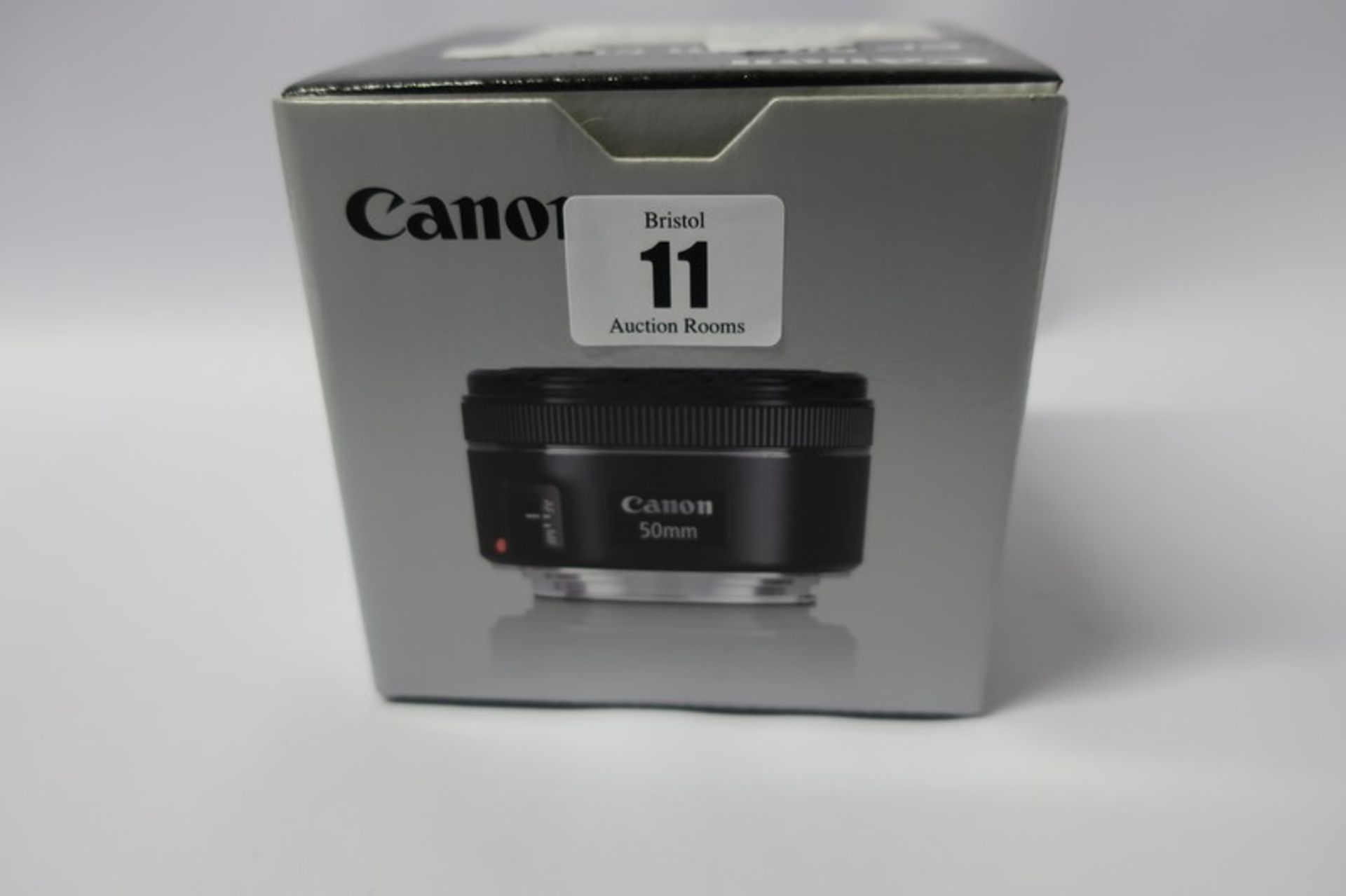 A boxed as new Canon EF 50mm f/1.8 STM lens.